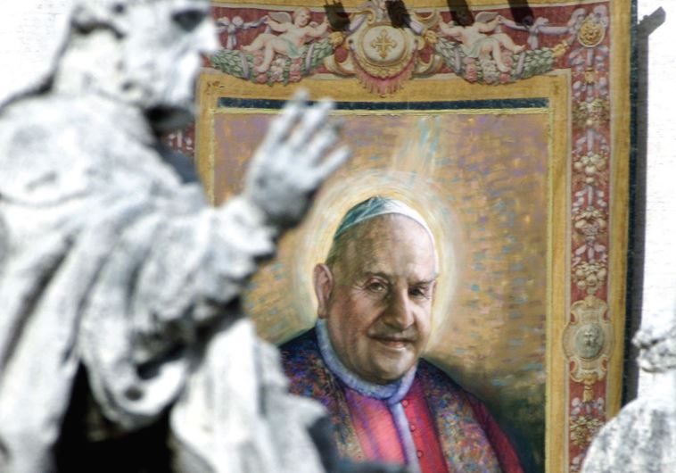 A TAPESTRY with the image of Pope John XXIII hangs on the facade of St. Peter’s facade during a beatification ceremony in 2000.