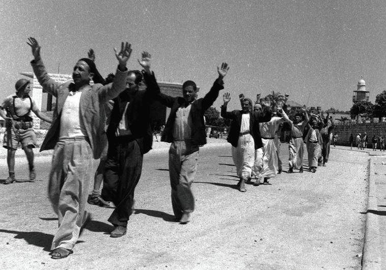 ARAB RESIDENTS of the town of Ramle, southeast of Tel Aviv, raise their hands in surrender to Israeli soldiers in July of 1948. Did the Mufti represent them?