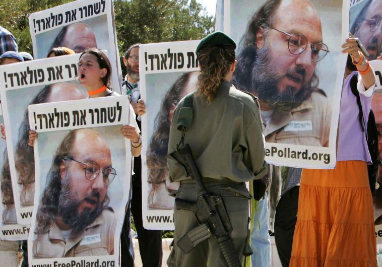 Israeli protesters hold posters of Jonathan Pollard, who was convicted for spying on the United States in 1987, in front of the Israeli Prime Minister's office in Jerusalem June 19, 2005