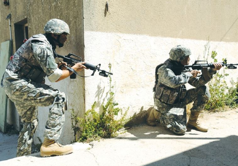 SPECIAL FORCES SOLDIERS drill recently in an urban environment that is part of the Elbit Combat Training System.