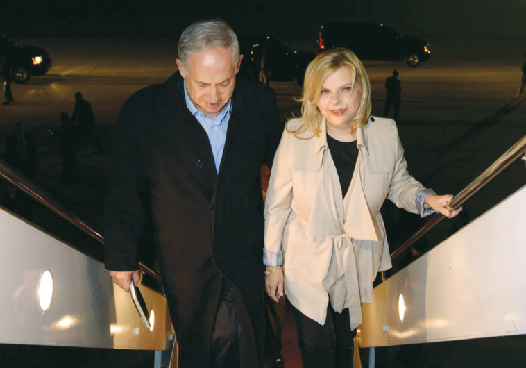 PRIME MINISTER Benjamin Netanyahu and his wife, Sara, board a plane