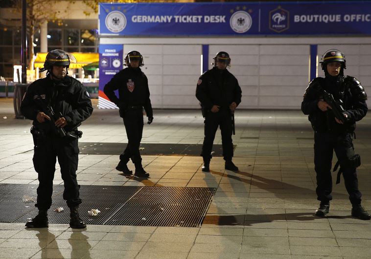 Police stand outside the Stade de France where explosions were reported to have detonated outside the stadium during the France vs German friendly soccer match near Paris, November 13, 2015