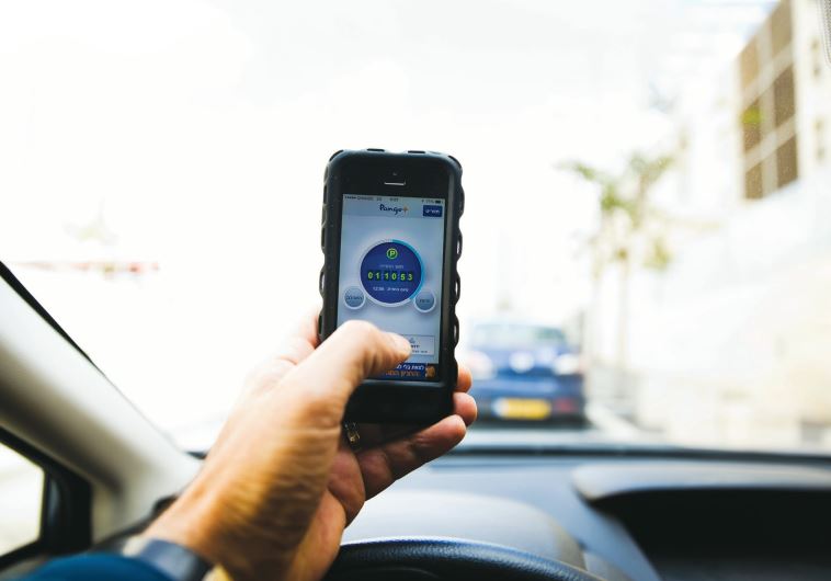 PANGO, an Israeli parking app, is seen on a smartphone in Jerusalem earlier this year. A band of young entrepreneurs, policy makers and investors are starting to change the Jerusalem ecosystem and bring it in line with Tel Aviv as a modern, hi-tech hub.