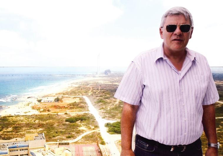 Hadera Mayor Tzvika Gendelman on a seaside balcony