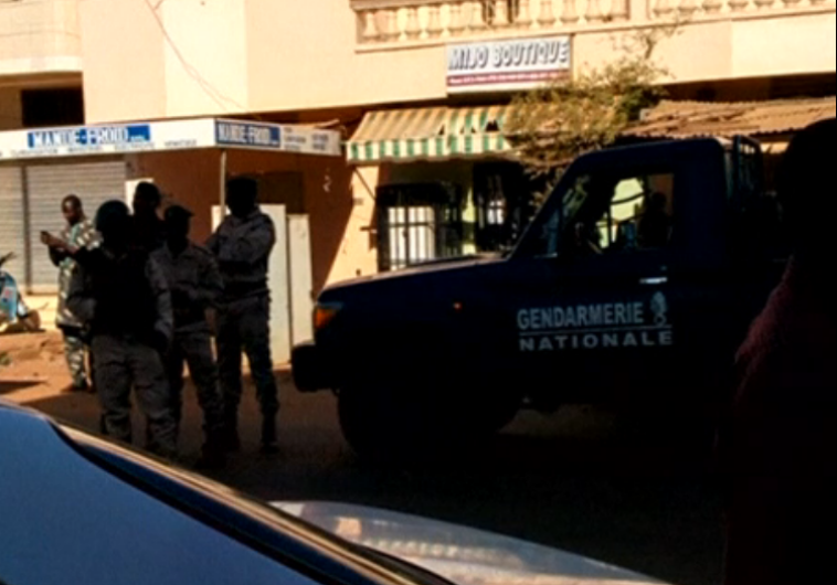 Security forces surround a luxury hotel in Mali's capital Bamako, after Islamist gunmen take 170 people hostage inside
