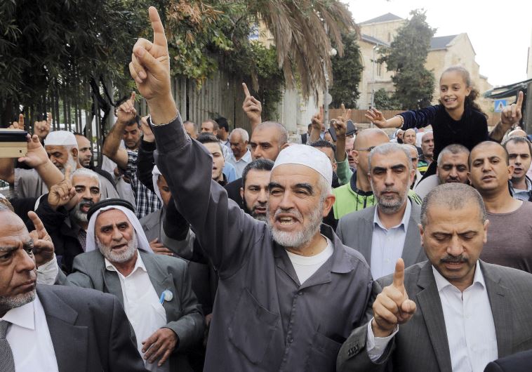 Leader of the northern Islamic Movement Sheikh Raed Salah gestures after leaving the district court in Jerusalem October 27, 2015.