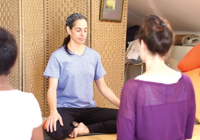 Kady Harari leads a yoga class