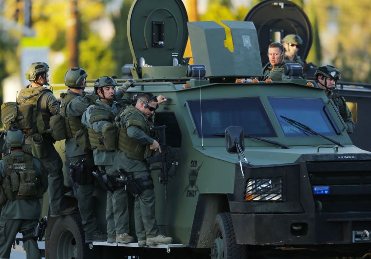 Police officers conduct a manhunt after a mass shooting in San Bernardino, California December 2, 2015