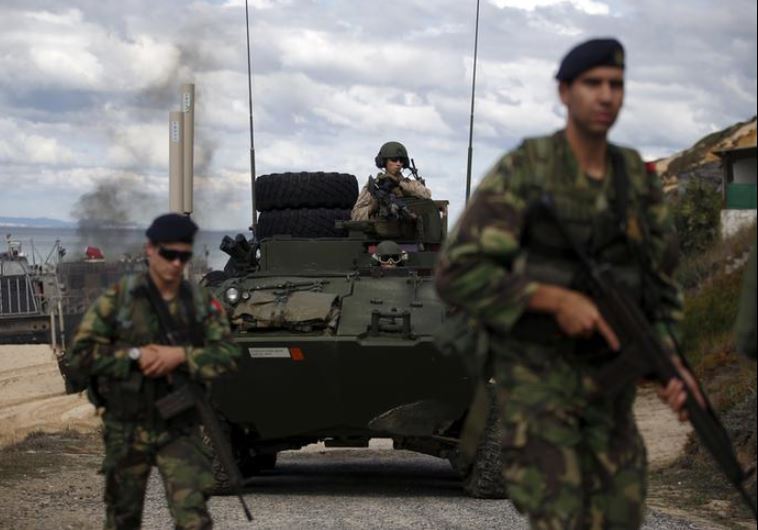 NATO soldiers attend a NATO military exercise.