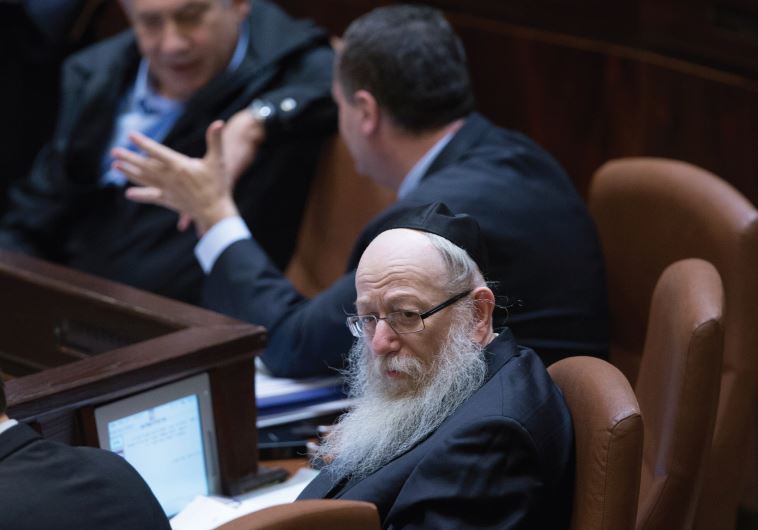 Health Minister Yaakov Litzman of the United Torah Judaism party sits with other ministers in Benjamin Netanyahu’s coalition government during a Knesset session, November 23