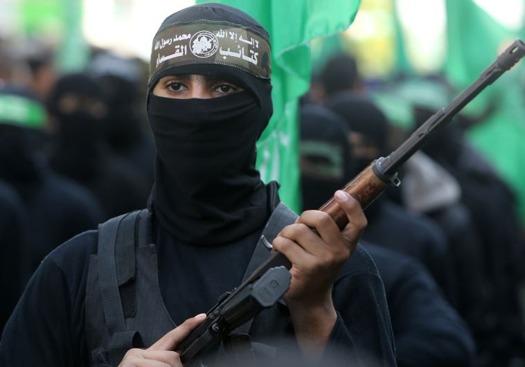 Palestinian militants of the Ezzedine al-Qassam Brigades, the Hamas' armed wing, take part in a rally in Gaza City