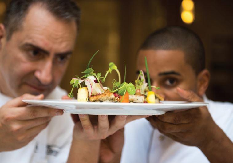 Chefs Itzik Mizrahi Barak and Joseph JJ Johnson with their creation.