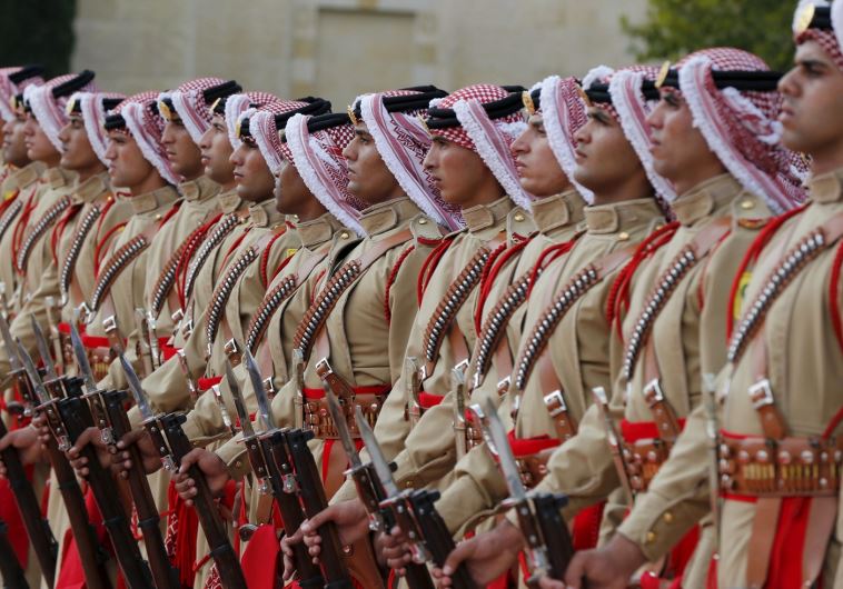 An honor guard marches at the Royal Palace in Amman, Jordan