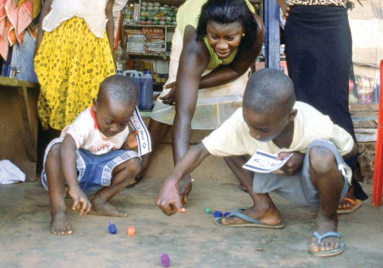 SPINNING HANUKKA dreidels in Ghana.