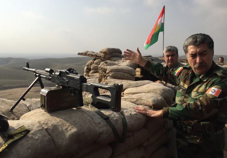 Hussein Yazdanpana, vice-president of the Kurdistan Freedom Party (PAK) gestures as he shows the frontline position his soldiers occupy fighting Islamic State northwest of Kirkuk
