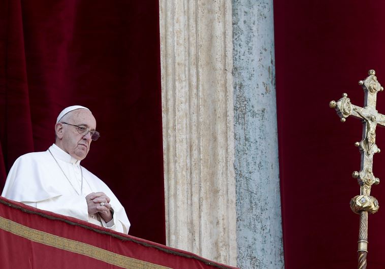 Pope Francis delivers a "Urbi et Orbi" message from the balcony overlooking St. Peter's Square at the Vatican December 25, 2015