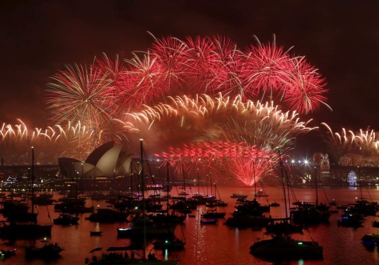 Fireworks explode over the Sydney Opera House and Harbour Bridge as Australia's largest city ushers in the New Year