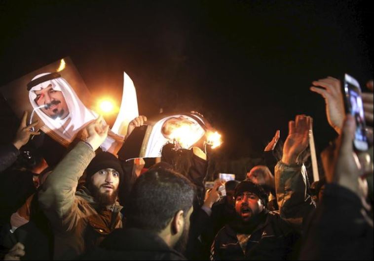 People protest in front of Saudi Arabia's embassy during a demonstration in Tehran January 2, 2016. Iranian protesters stormed the Saudi Embassy in Tehran early on Sunday morning as Shi'ite Muslim Iran reacted with fury to Saudi Arabia's execution of a prominent Shi'ite cleric.