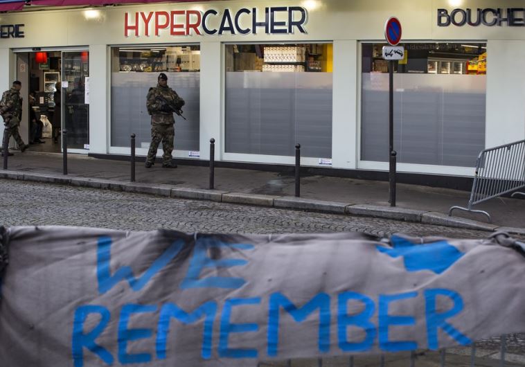 A French soldier patrols outside the Hypercacher kosher supermarket in Paris