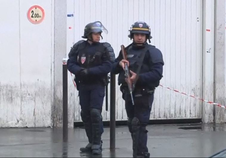 French officers patrol the street after a man shouted Allahu Akbar and tried to carry out attack at a Paris police station