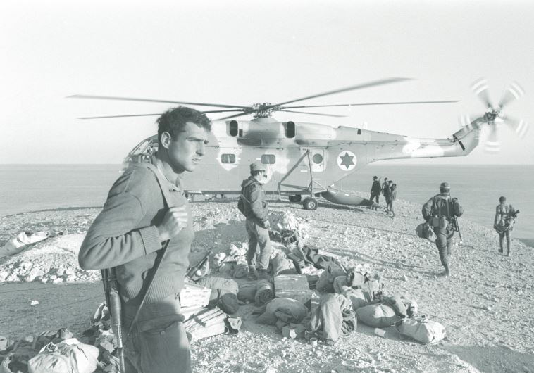A helicopter waits to fly troops and equipment back after the completion of military action on Egypt’s Shadwan Island in 1970 during the War of Attrition