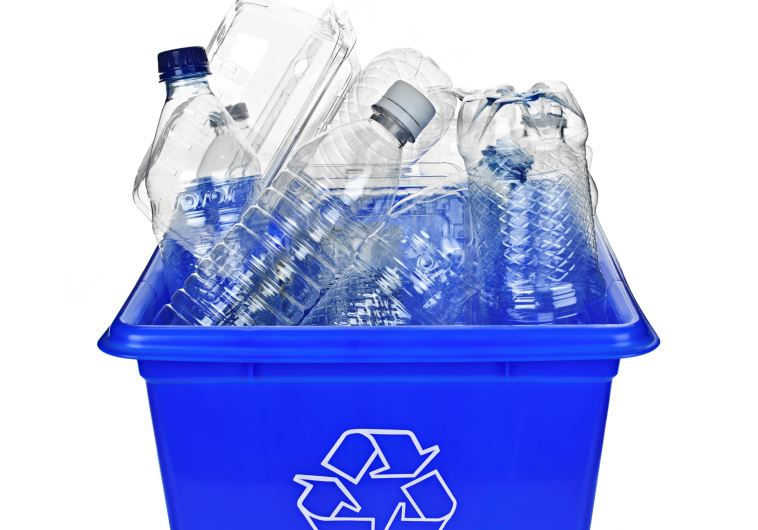 Recycling box filled with clear plastic containers (illustrative)