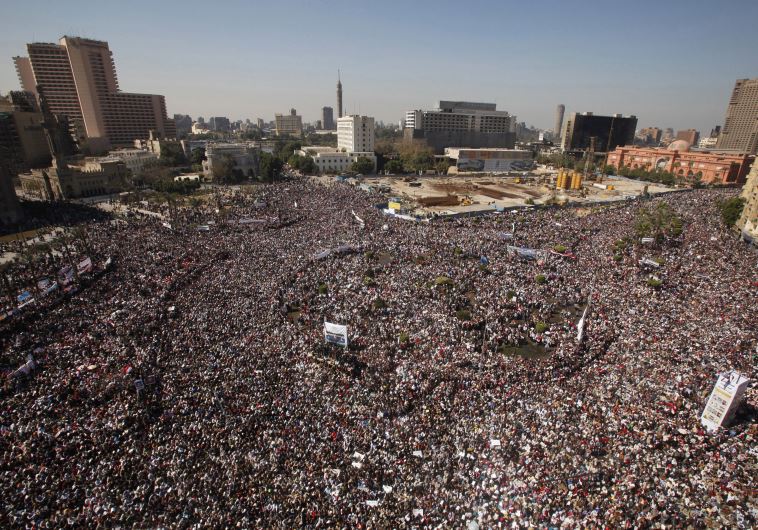 Opposition supporters attend Friday prayer in Tahrir Square in Cairo February 11, 2011