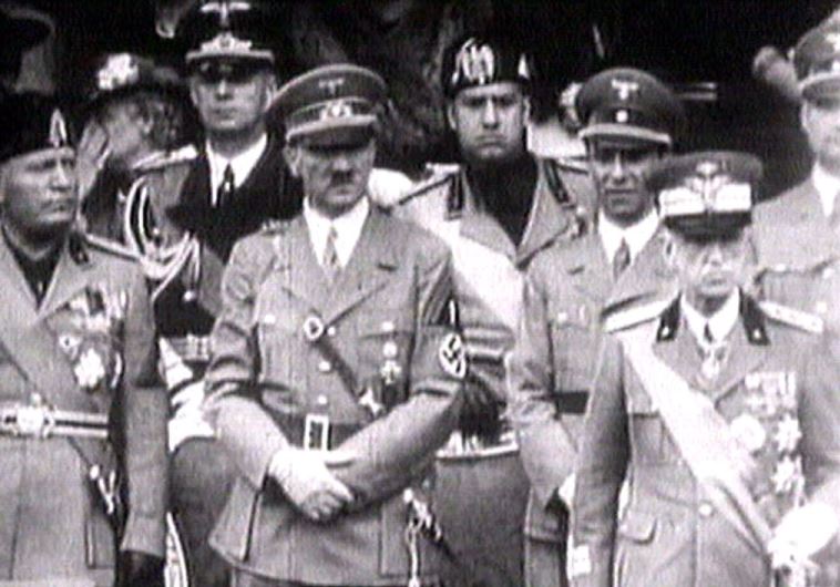 King Victor Emanuel III, (R) Adolf Hitler (C) and Benito Mussolini (L) watch fascist troops march past from a balcony in central Rome in this 1941 television file footage