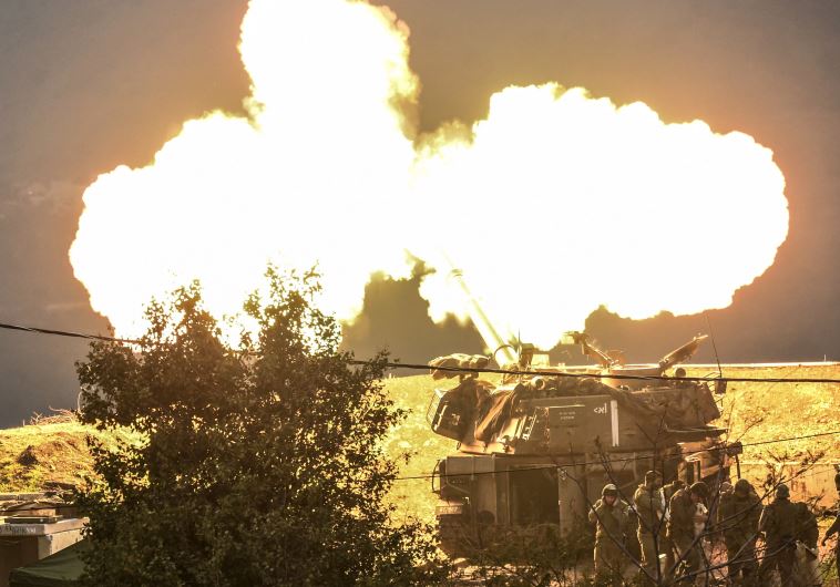 An IDF self-propelled gun fires a shell into Lebanon, January 4, after a roadside bomb exploded next to an army patrol on the northern border