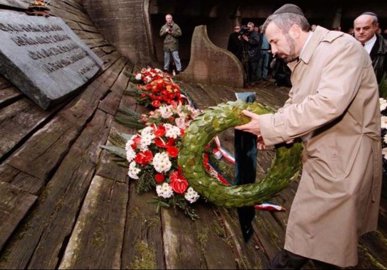 Ognjen Kraus, leader of Croatia's Jewish community, lays a wreath on the monument of Fascist victims, mostly Jews, Serbs and gypsies, during a commemoration held at the site of the former World War Two concentration camp in Jasenovac April 19, 1998