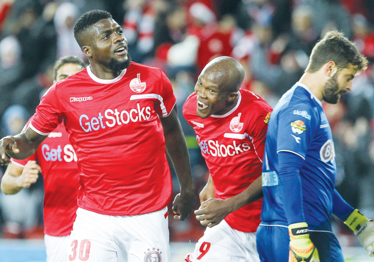Hapoel Beersheba midfielder John Ogu (left) celebrates after scoring his team’s second goal in last night’s 2-0 victory over Maccabi Netanya at Turner Stadium.