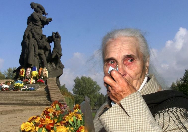 Ludmila Pynikh, 77, grieves during a mourning ceremony at Babi Yar in Kiev [File]