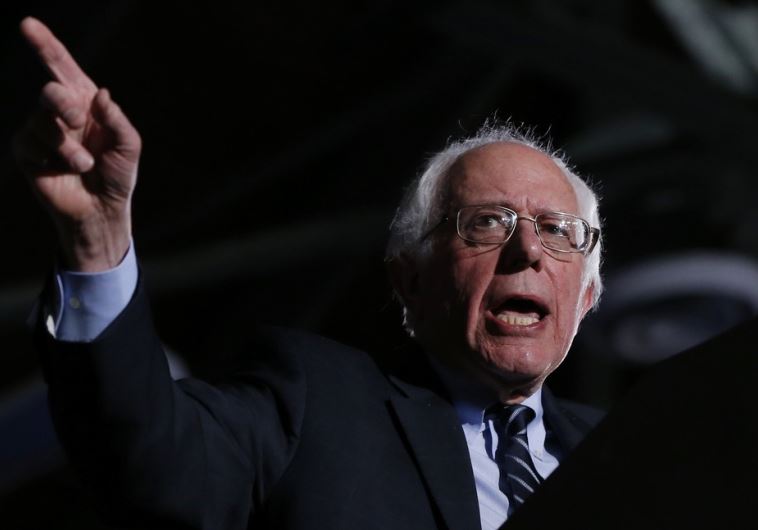 Democratic US presidential candidate Bernie Sanders speaks after winning at his 2016 New Hampshire presidential primary night rally in Concord