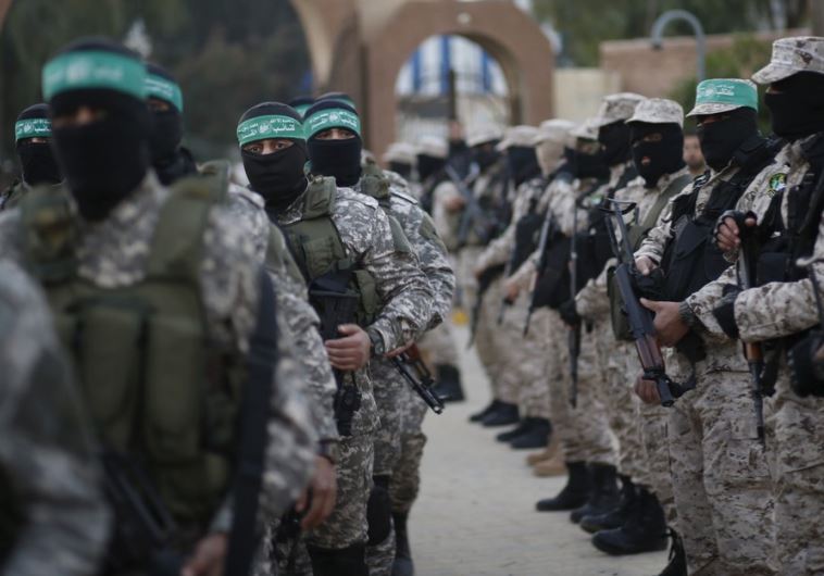 Palestinian Hamas militants take part in a rally in memory of their seven comrades, who were killed when a tunnel collapsed close to the Gaza Strip's eastern border with Israel