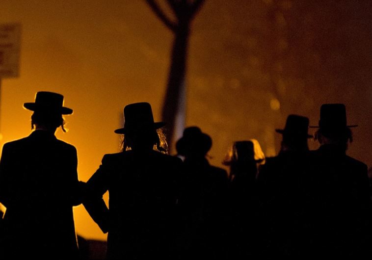 Hassidic Jews arrive at a mass gathering in Brooklyn