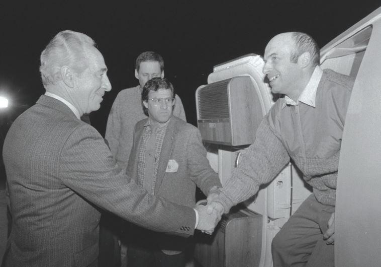 THEN PRIME MINISTER Shimon Peres greets newly released Prisoner of Zion Natan Sharansky at Ben-Gurion Airport where he was flown from Germany after being freed from a Soviet prison, exactly 30 years ago on Thursday or February 11, 1986.
