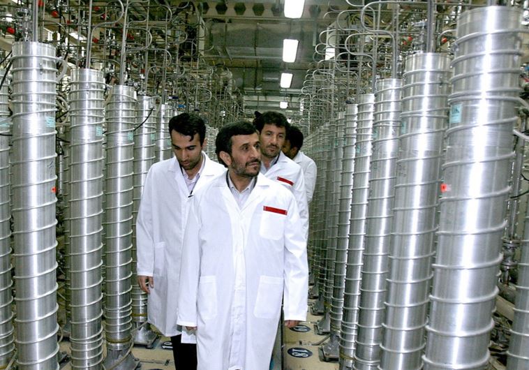 Iranian President Mahmoud Ahmadinejad (C) visits the Natanz nuclear enrichment facility, 350 km (217 miles) south of Tehran, April 8, 2008