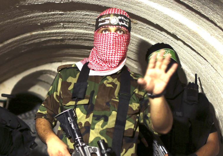 A gunman from the Izz ad-Din al- Qassam Brigades, the armed wing of Hamas, photographed inside an underground tunnel in Gaza, in 2014.
