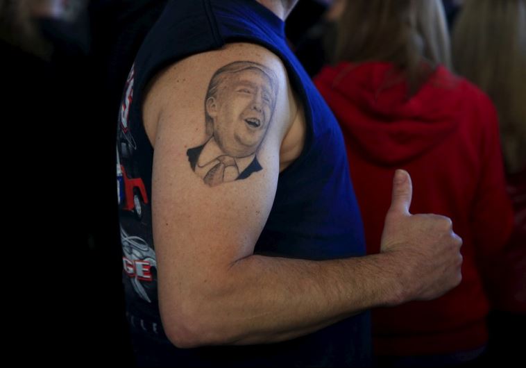 A supporter shows his tattoo before US Republican presidential candidate Donald Trump's campaign rally in Youngstown, Ohio