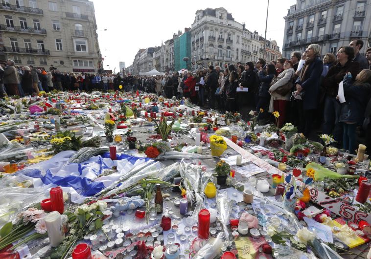 People gather at a street memorial in Brussels following Tuesday's bombings in Brussels