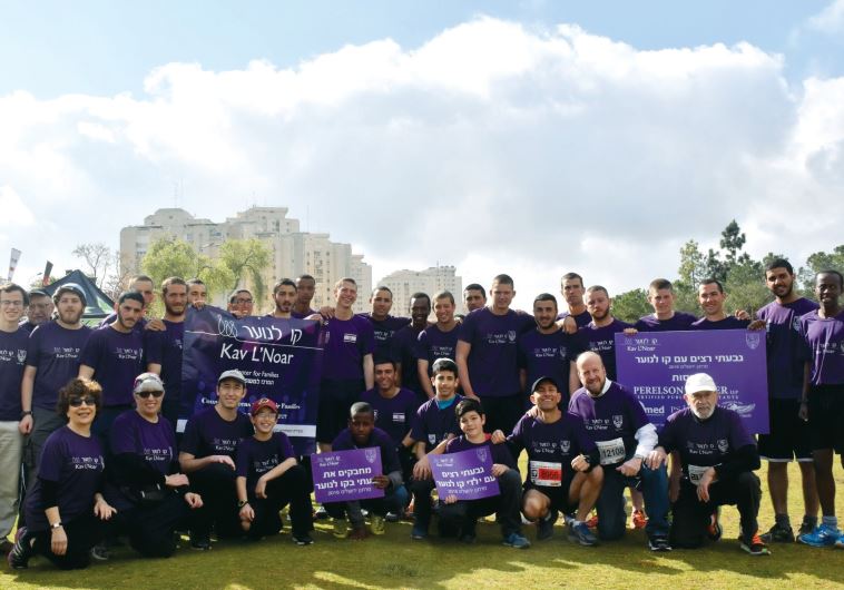 The Givati Brigade poses for a team photo with members of staff. Over 2,000 Givatis participated