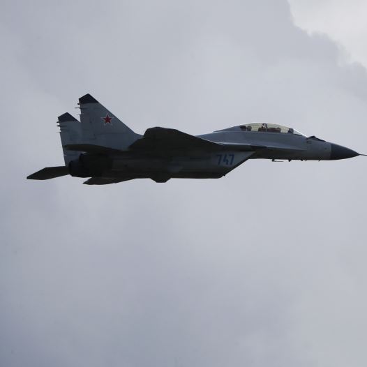 MiG-35 (L) jet fighter and MiG-3, Soviet era fighter aircraft, perform during the MAKS International Aviation and Space Salon in Zhukovsky outside Moscow, Russia, August 30, 2015
