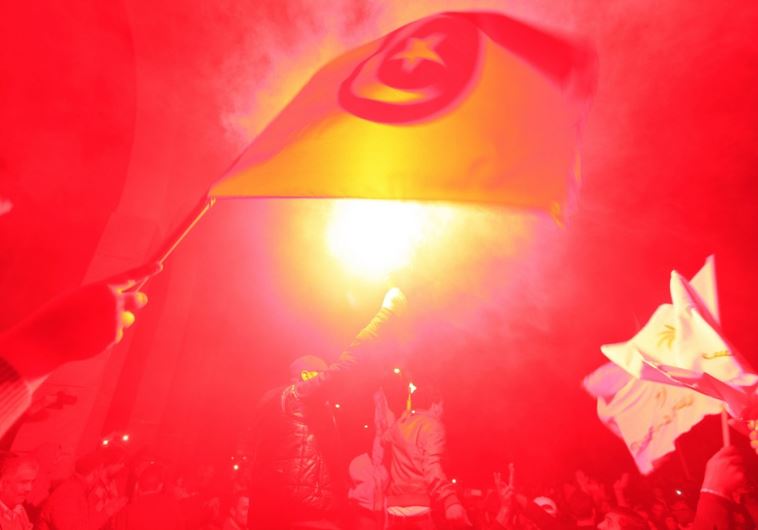 Tunisians celebrate an election nearly four years after an uprising ousted autocrat Zine El-Abidine Ben Ali