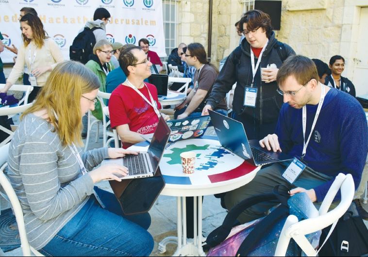SOFTWARE DEVELOPERS from Israel and abroad work to improve the Wikipedia online encyclopedia at Hansen House in Jerusalem over the weekend