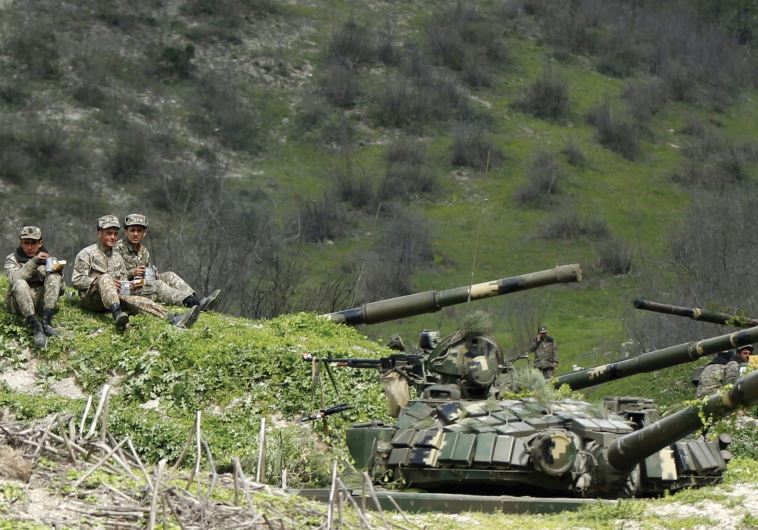 SERVICEMEN OF the army of Nagorno-Karabakh rest at their positions near the village of Mataghis, yesterday.