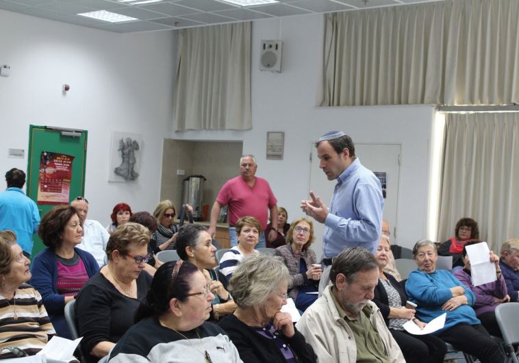 THE AUTHOR lecturing to members of a kibbutz in Israel.