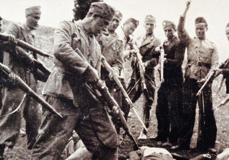 VICTIMS OF the Nazi-backed Ustasha regime killed at the end of the World War Two lay on the ground surrounded by posing Ustasha soldiers near the Sava river in Croatia in 1945.