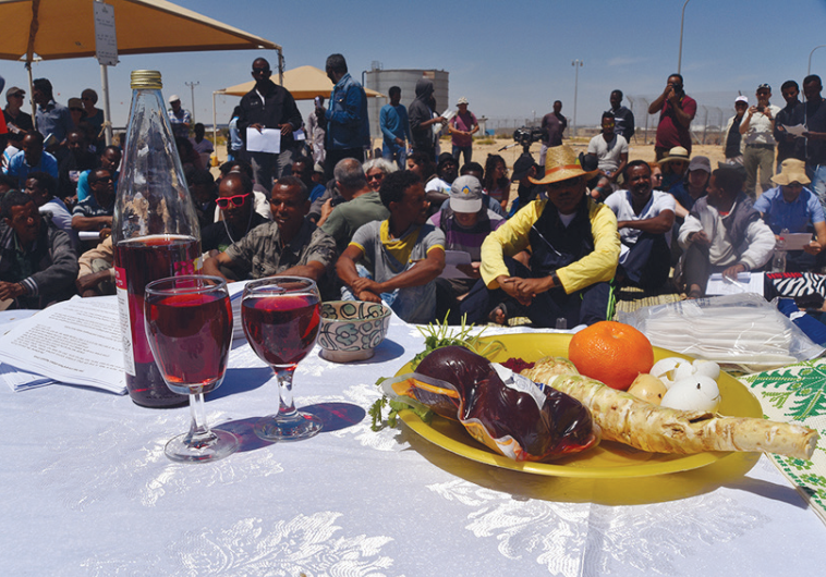 AFRICAN DETAINEES at the Holot detention center in the Negev celebrate a pre-Passover Seder on Friday initiated by Rabbis for Human Rights and Right Now: Advocates for Asylum Seekers in Israel