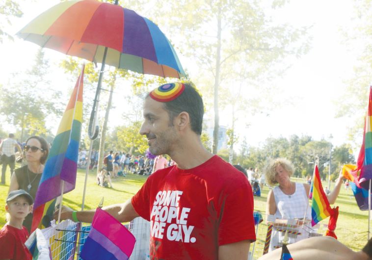 Vendors sell rainbow souvenirs at the Jerusalem Gay Pride parade, last year