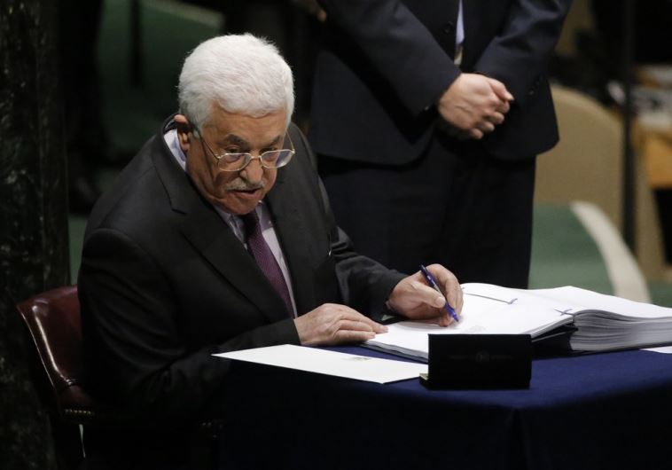 Palestinian Authority President Mahmoud Abbas signs the Paris Agreement on climate change at UN headquarters in New York